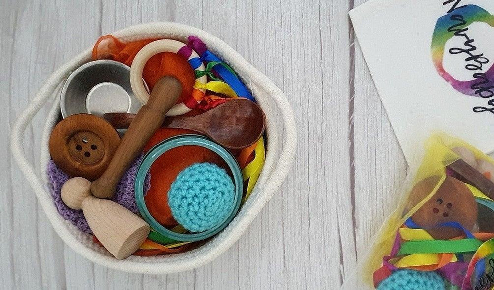 
                  
                    Woven basket with set of Heuristic toys wooden and metal in bright colours
                  
                